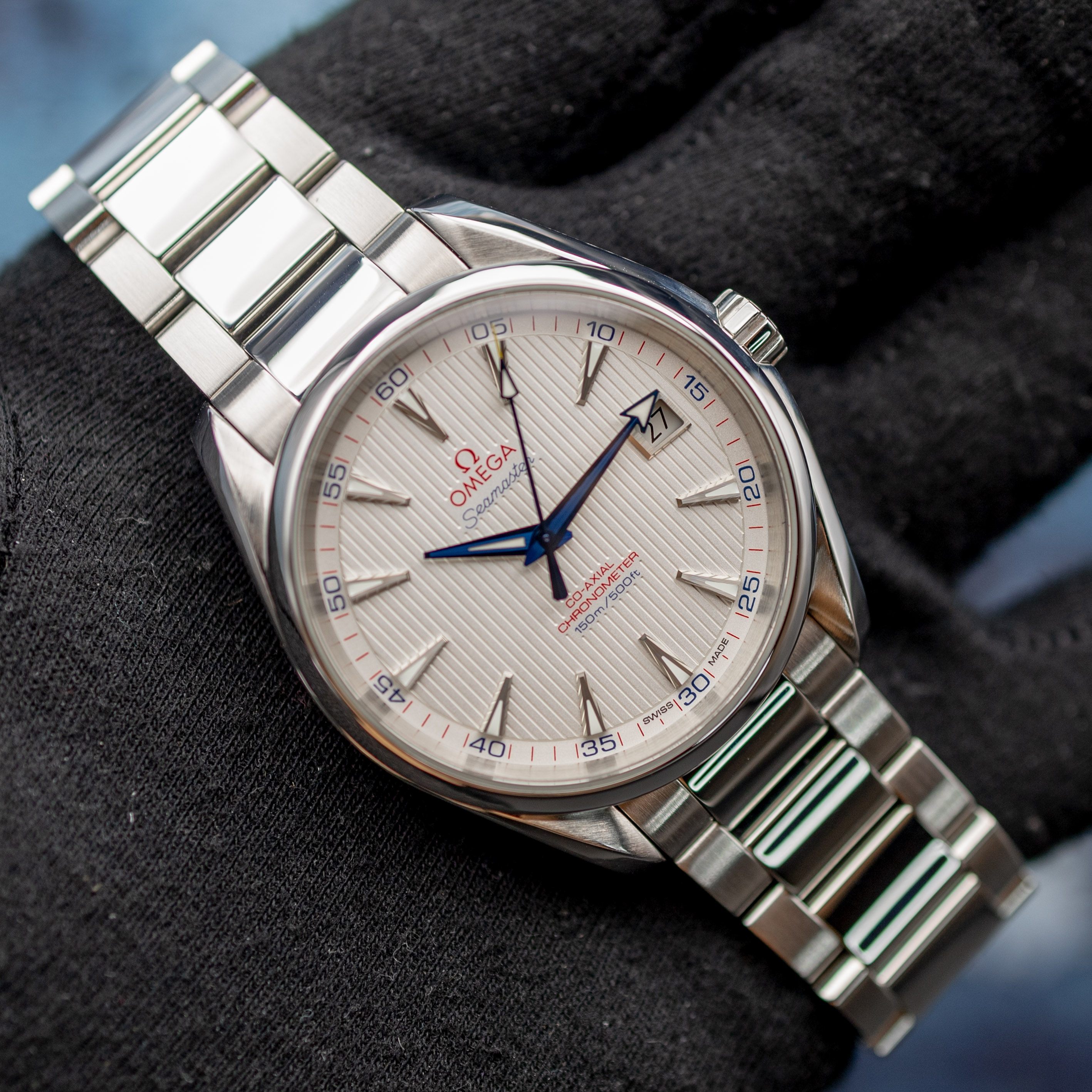 Omega Aqua Terra Captain's Watch full view on gloved hand showing bracelet and dial