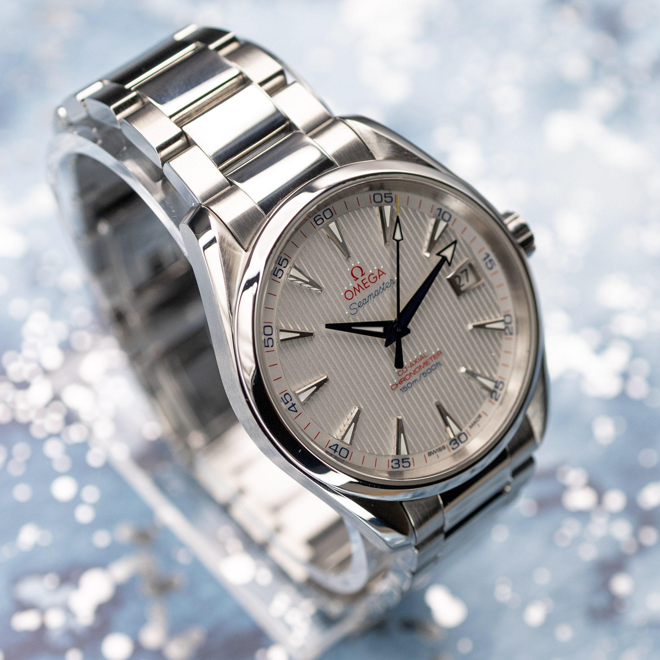 Omega Aqua Terra Captain's Watch straight-on dial shot with blue hands and red numerals
