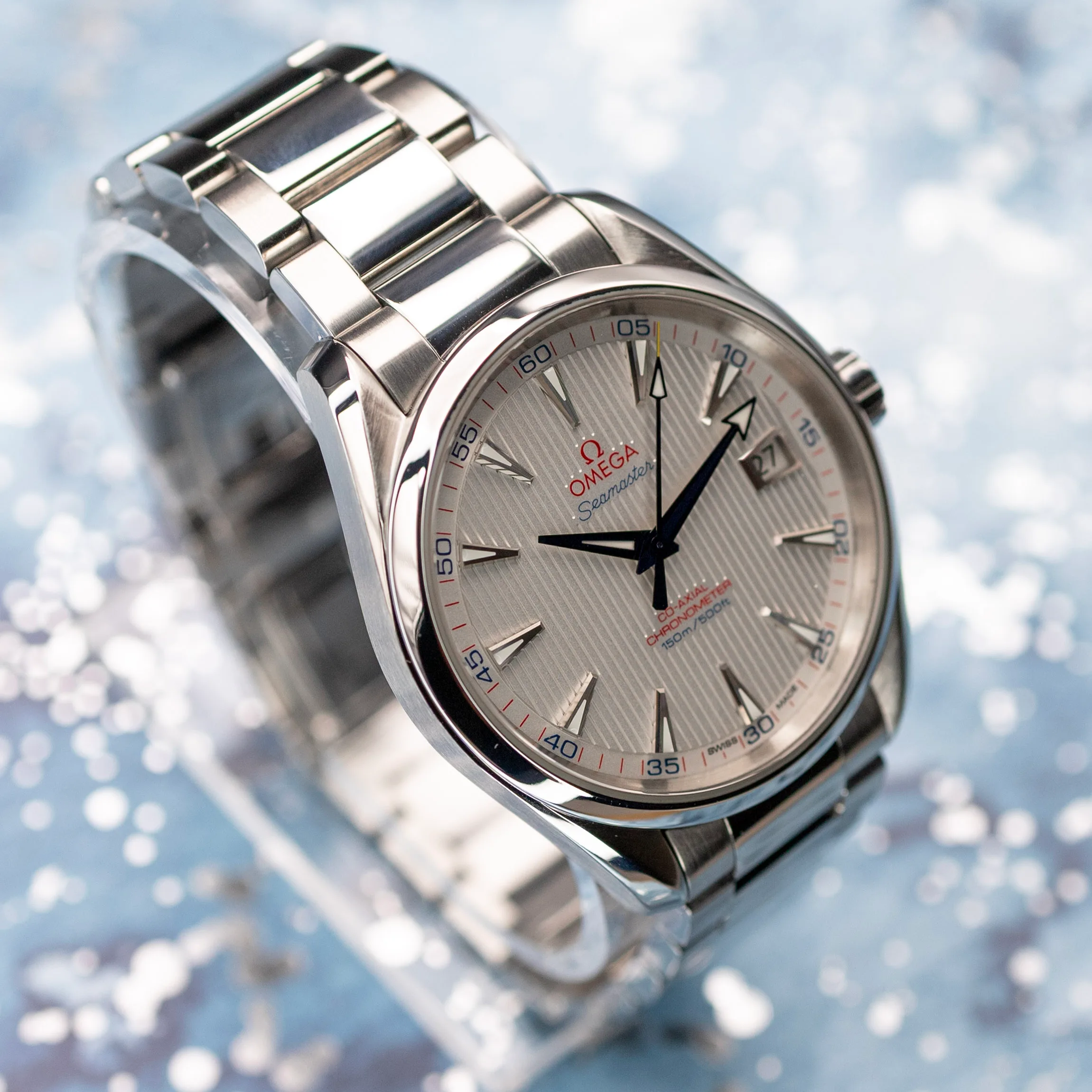 Omega Aqua Terra Captain's Watch straight-on dial shot with blue hands and red numerals