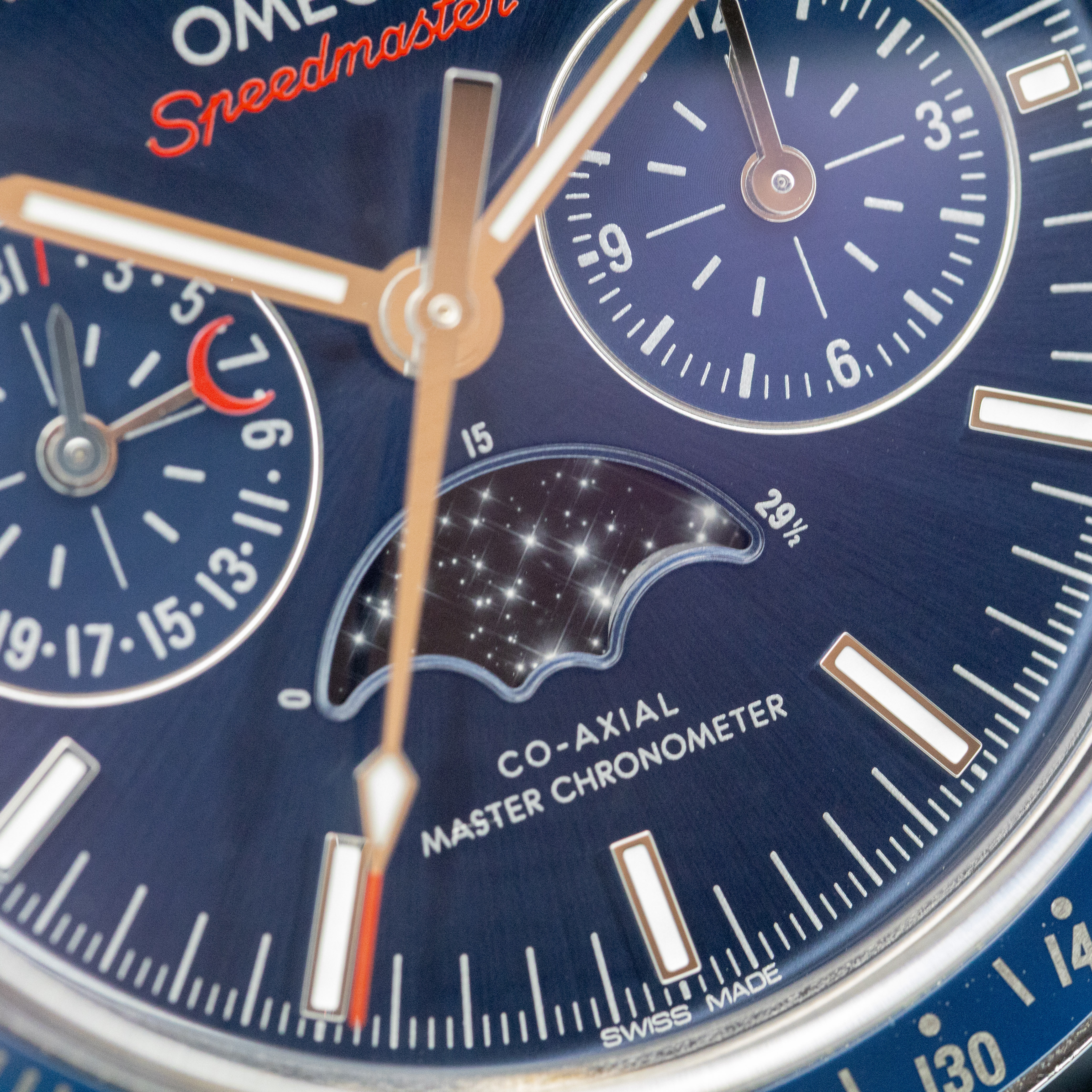 Omega Speedmaster Moonphase macro showing moonphase disc, subdials, and Co-Axial Master Chronometer text