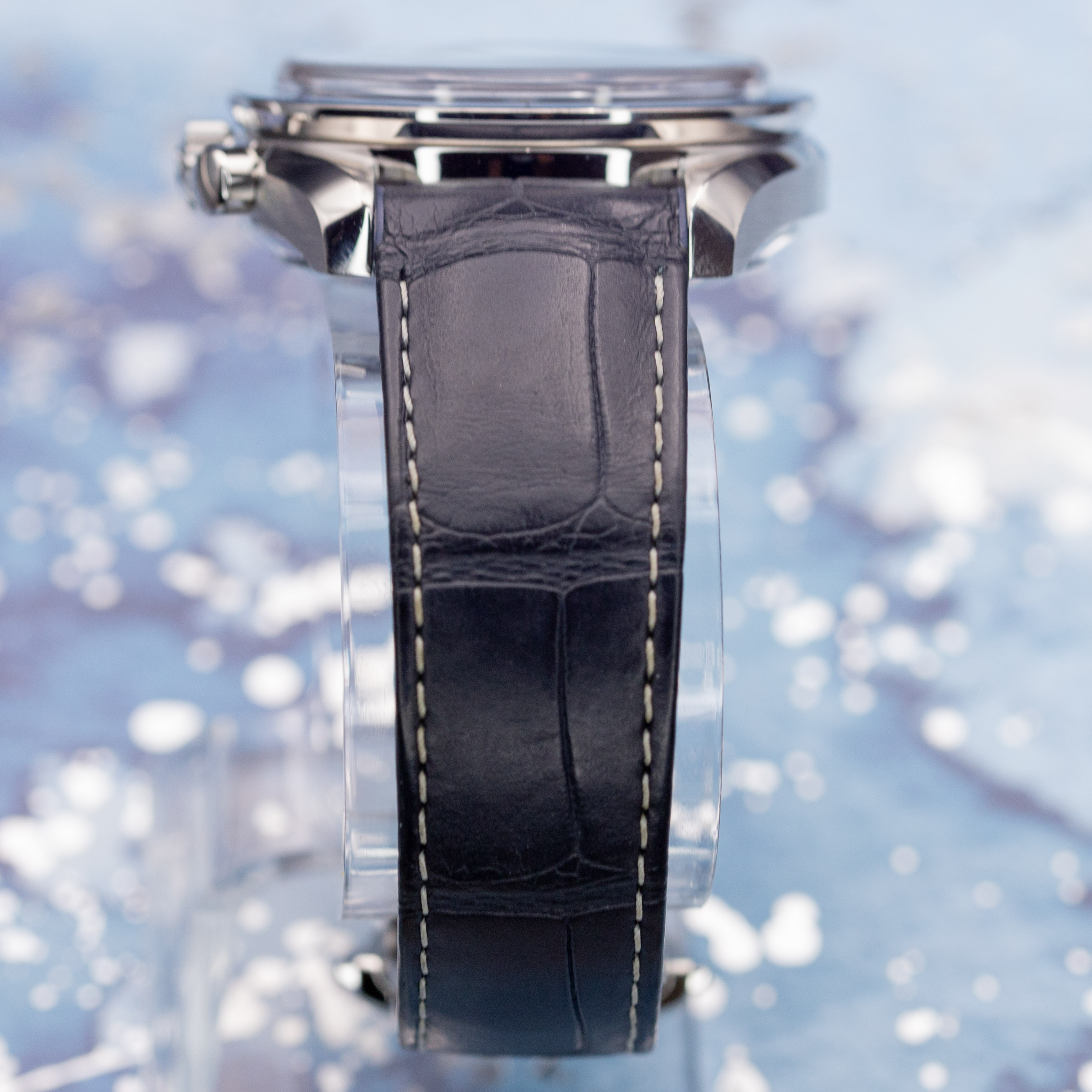Omega Speedmaster Moonphase blue dial on blue alligator strap, angled wrist shot