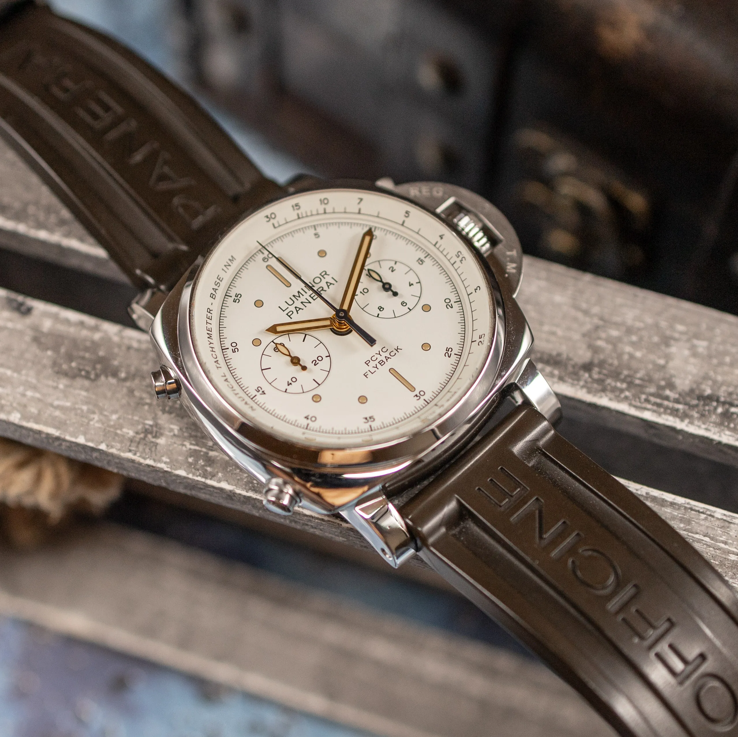 Panerai PAM00654 on rubber strap angled on a wooden crate