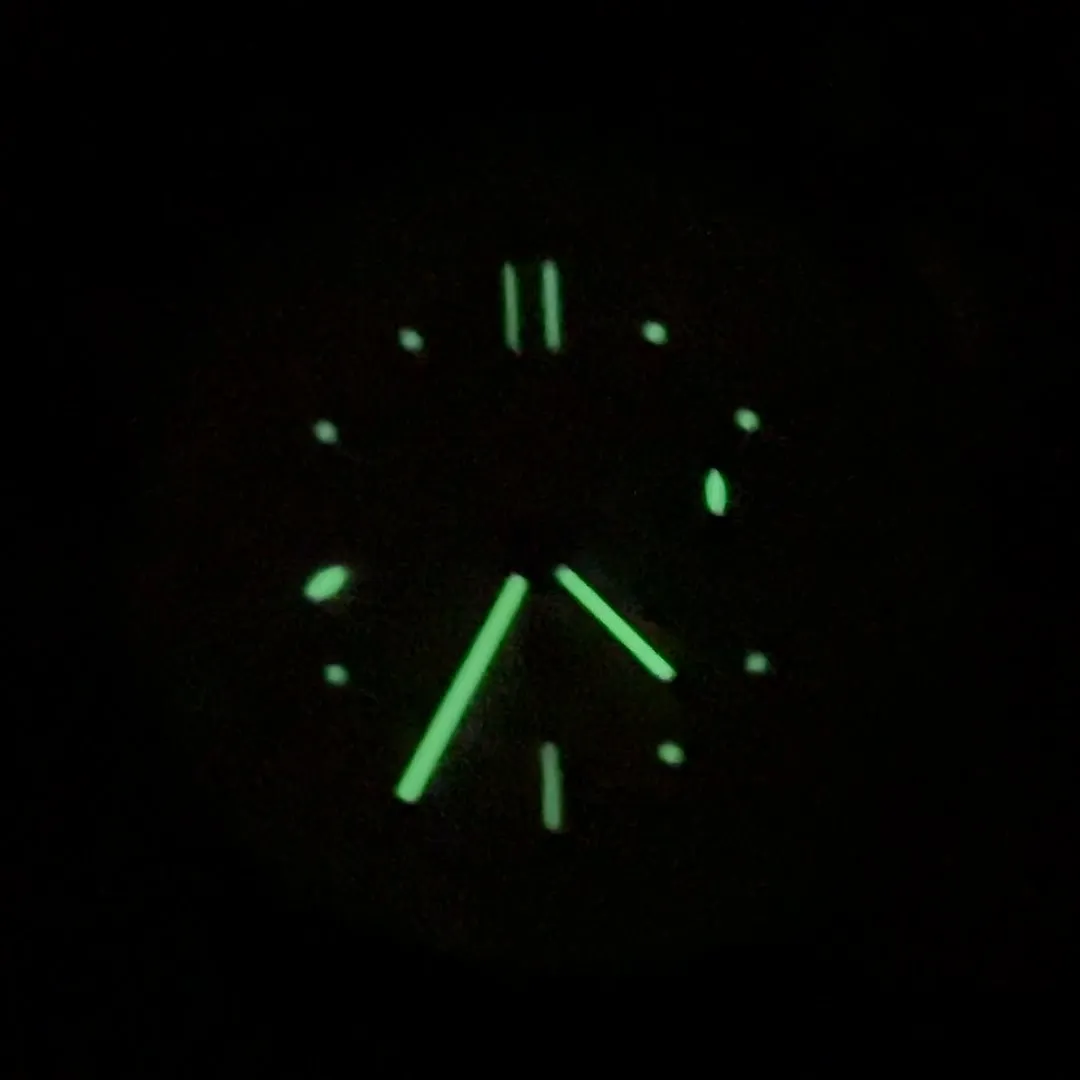 Panerai PAM00654 lume shot in the dark showing small dots and hands glowing green